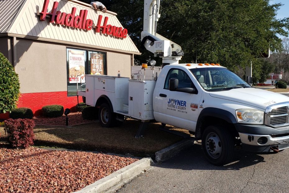 Joyner Electric and Security bucket truck - installing exterior restaurant lighting